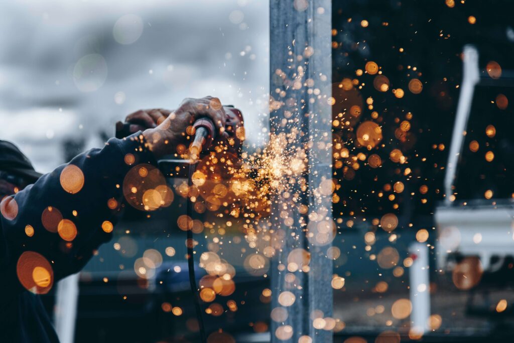 Welding sparks flying on metal — construction video production