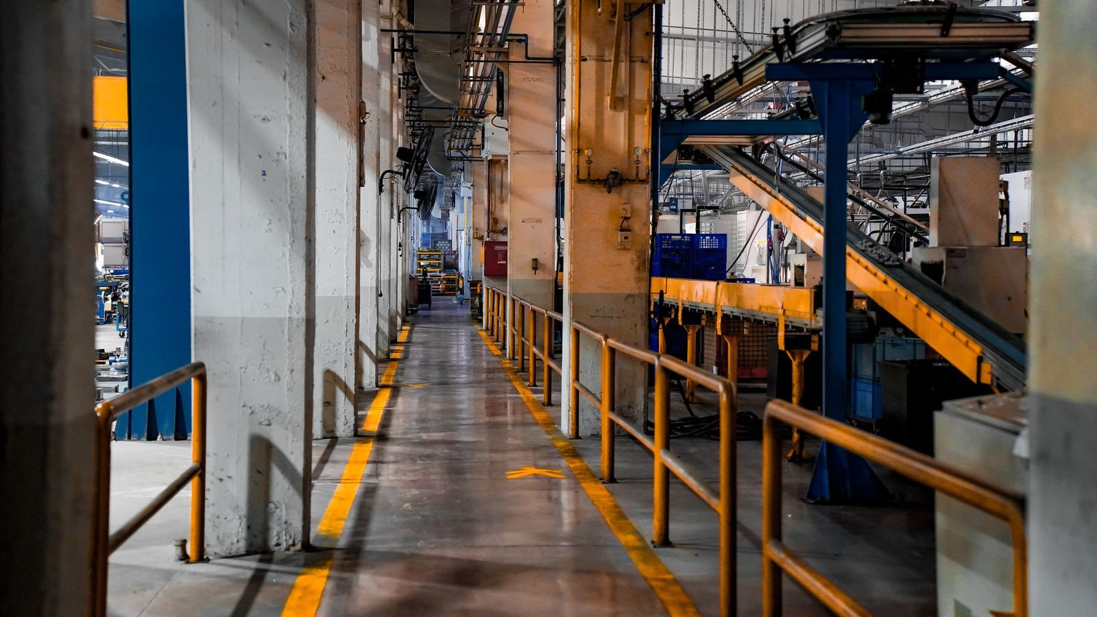 Wide view of a factory production line during a factory tour video