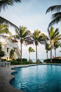Hotel pool and lounge area photographed at twilight