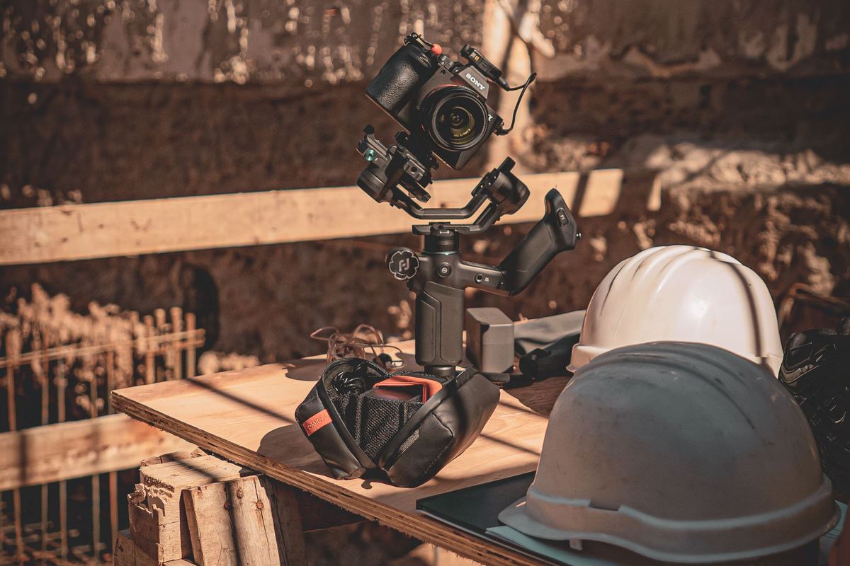 Video camera on a stabilizer set up at a construction site
