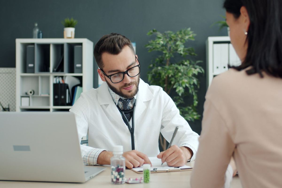 Doctor consulting a patient during a patient story video interview